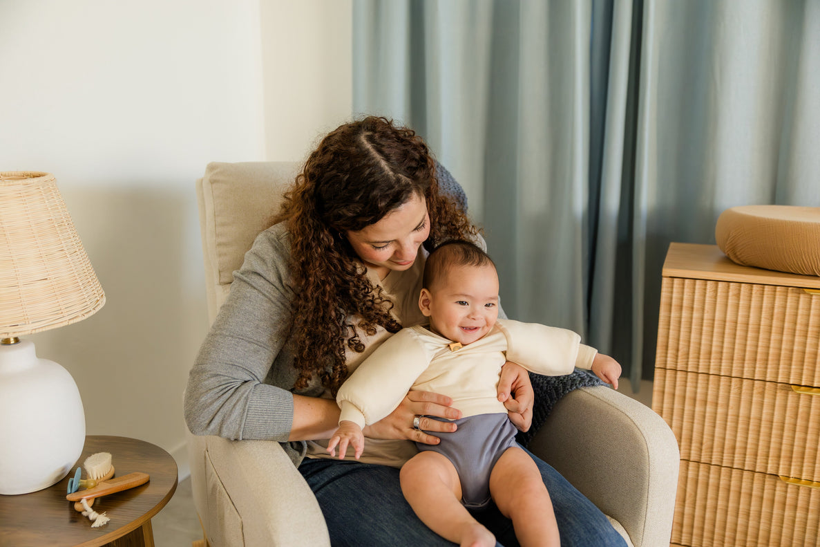 baby sitting in mom's lap before bedtime