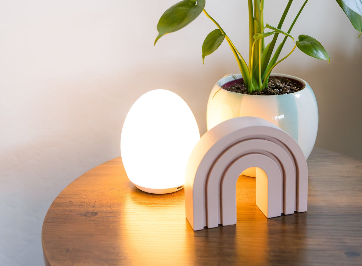night light on table with plant and rainbow decoration
