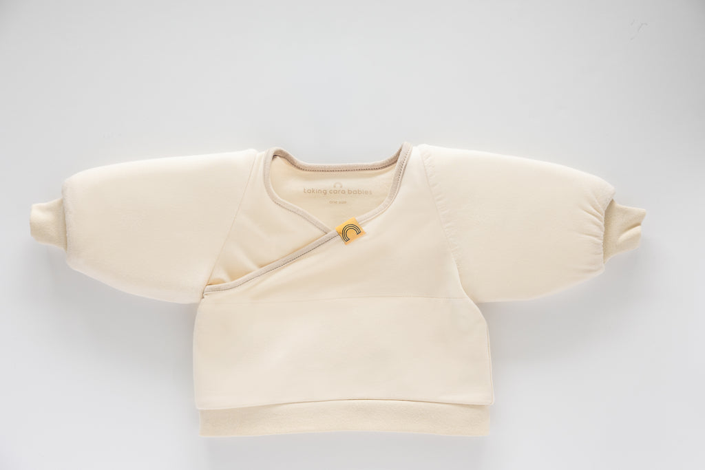 Coconut Cream Jacky swaddle transition jacket on a white background