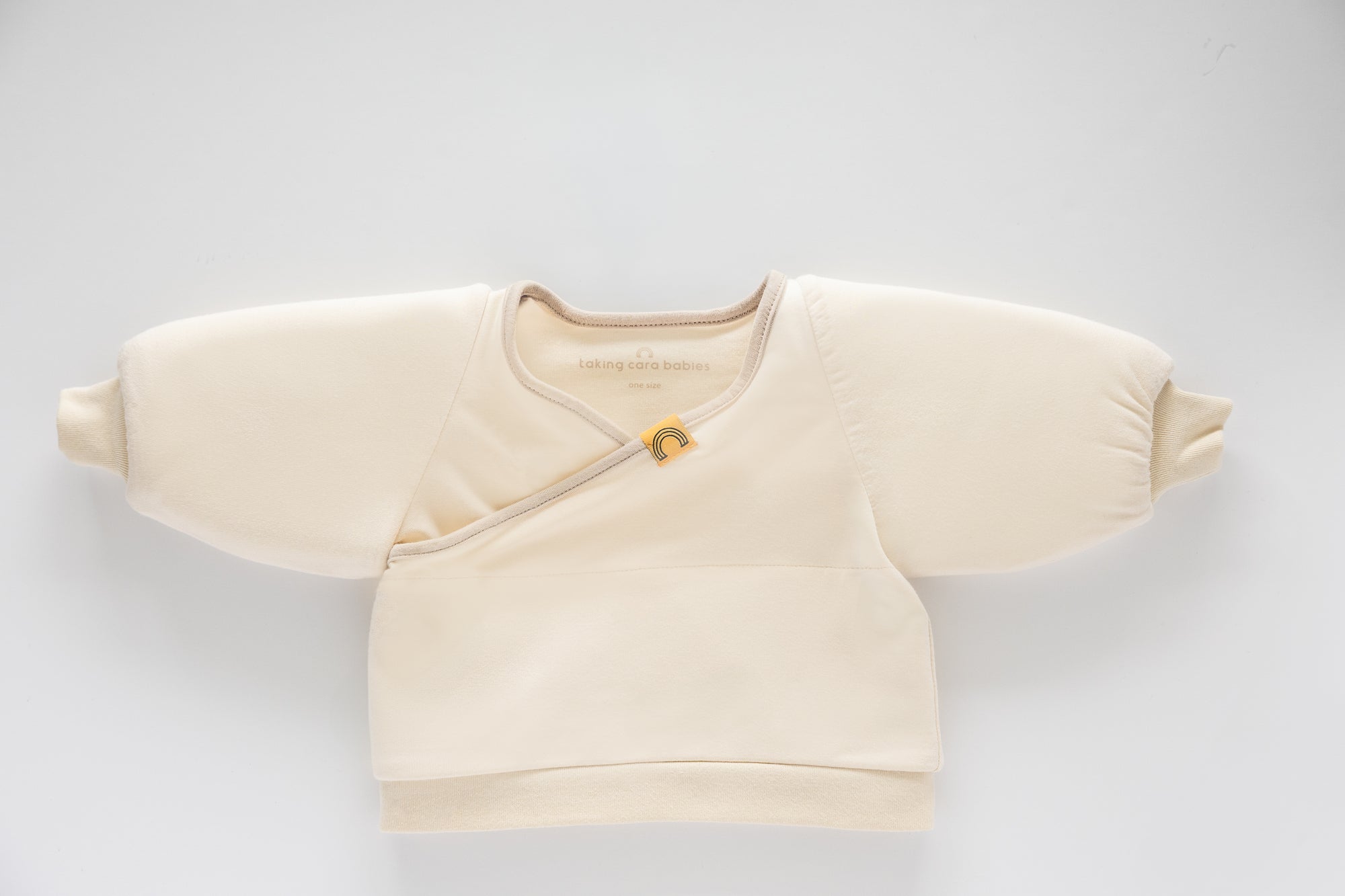 Coconut Cream Jacky swaddle transition jacket on a white background